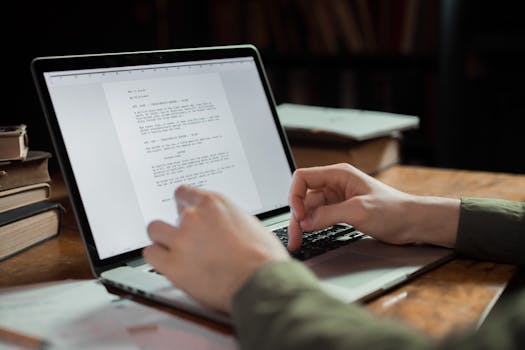 writer at desk with laptop